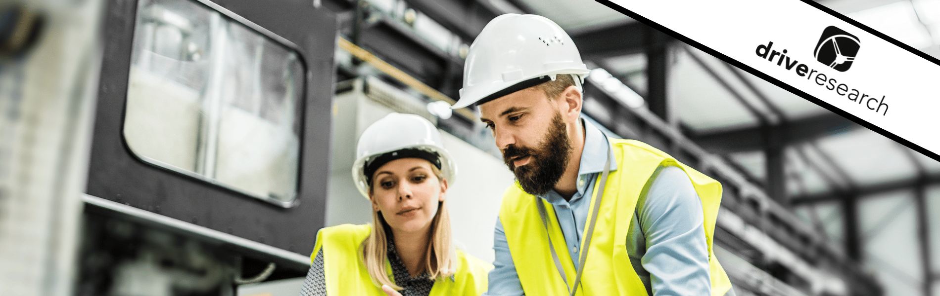 A Portrait of an Industrial Man and Woman Engineer with Laptop in a Factory, Working.