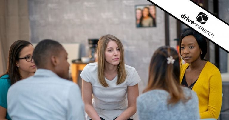 a group of people sitting around in a focus group circle