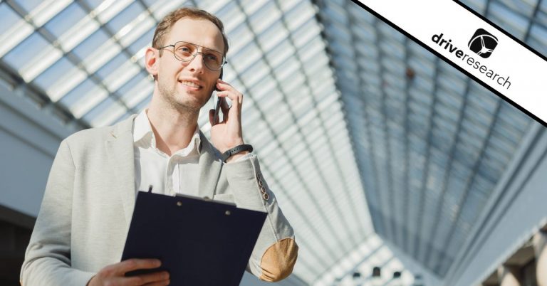 a man talking on the phone with a clipboard performing a phone survey