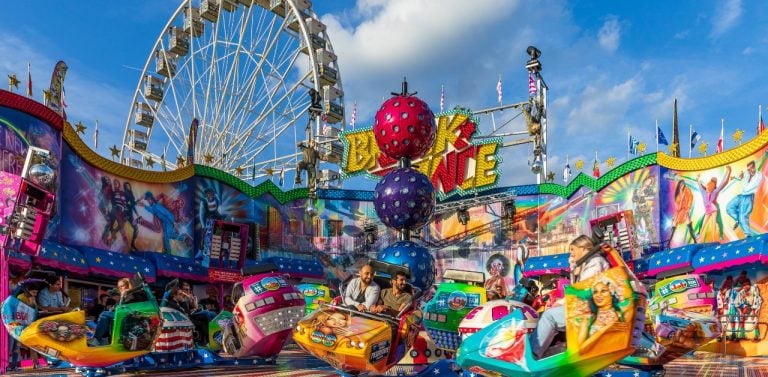 Image of fair during the summer with shot of ferris wheel