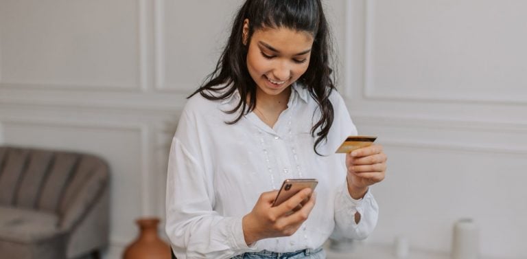 Woman online shopping on her phone