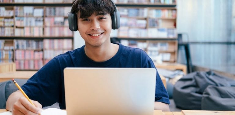 College student on computer in library