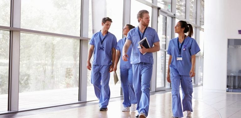 Healthcare professionals walking