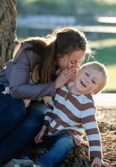 Mom telling son a secret