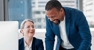 Business man laughing to business woman at office