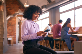 Female business woman texting at office