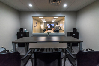 Focus group participants see through an observation room