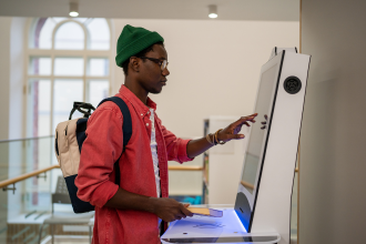 African american male using kiosk