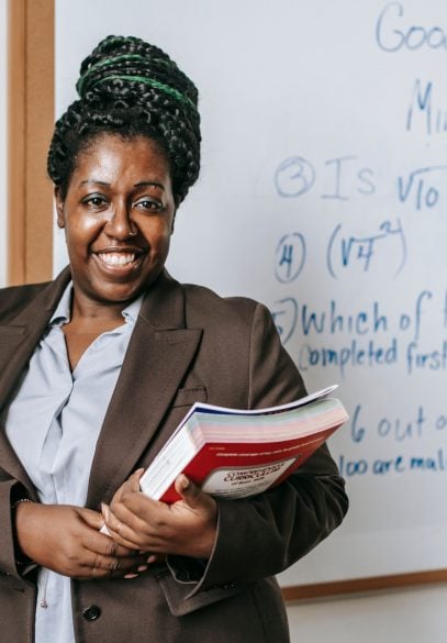 African american teacher in front of whiteboard