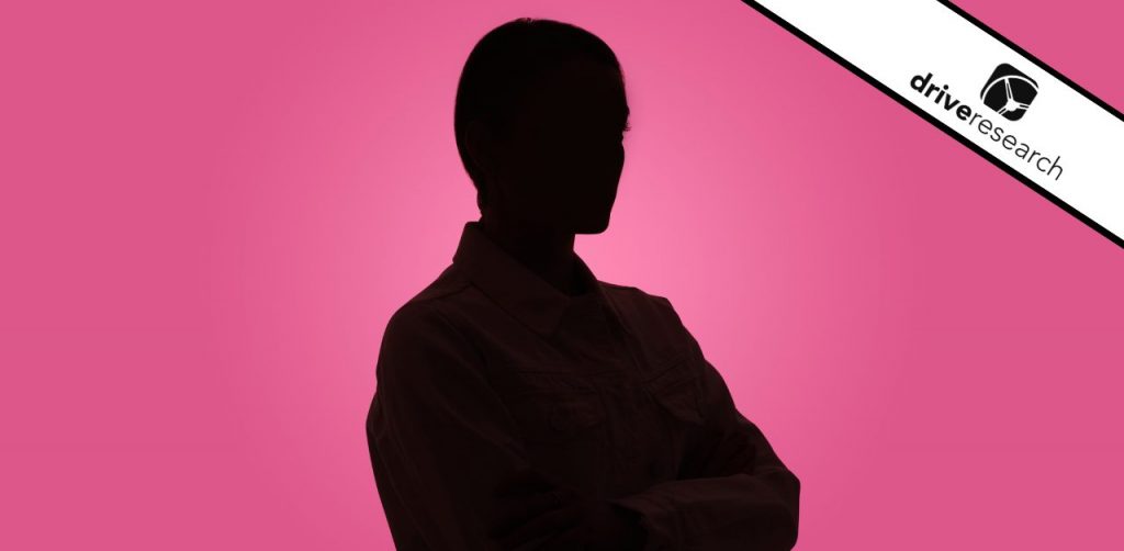 Anonymous black figure in front of pink background