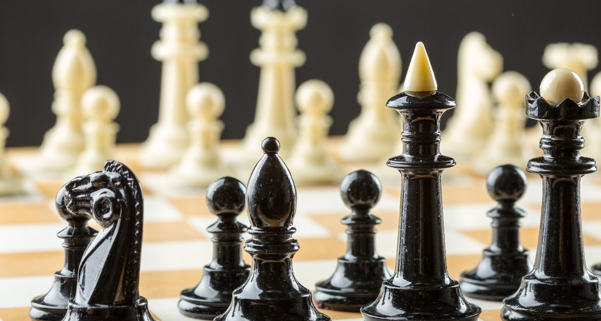 Black and white chess pieces on chess board