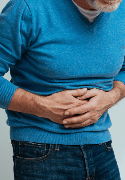 Male with IBD - hands holding stomach