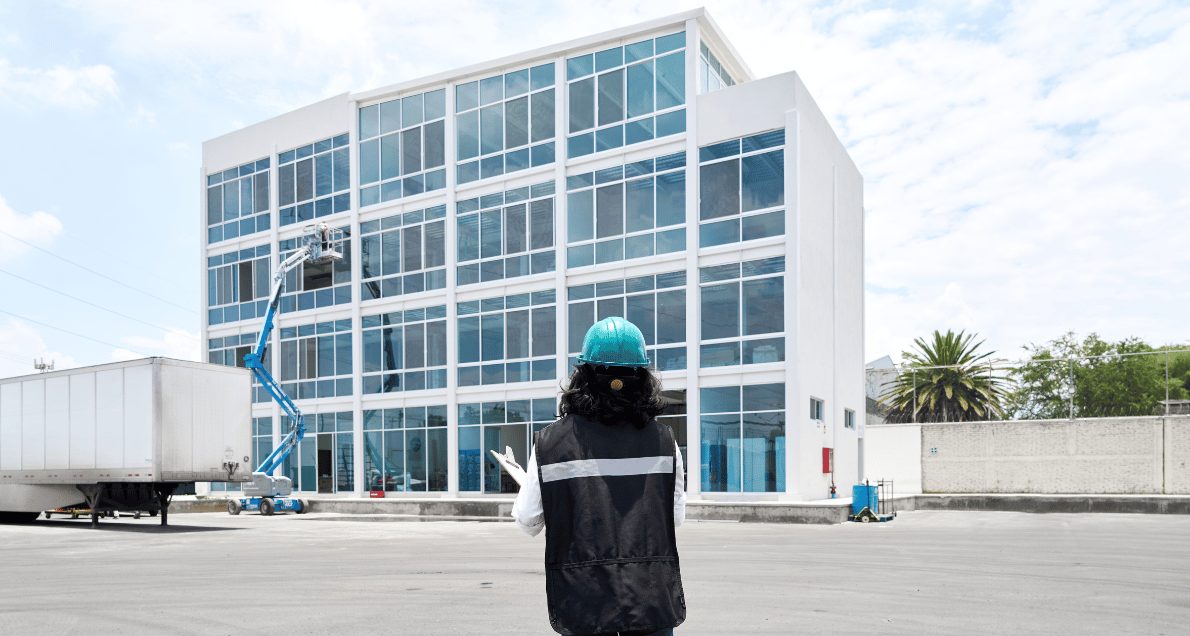 Professional engineer woman in safety equipment at construction site