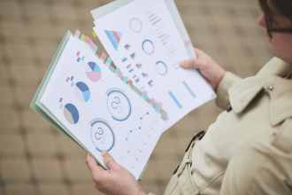 Woman looking at statistics on paper