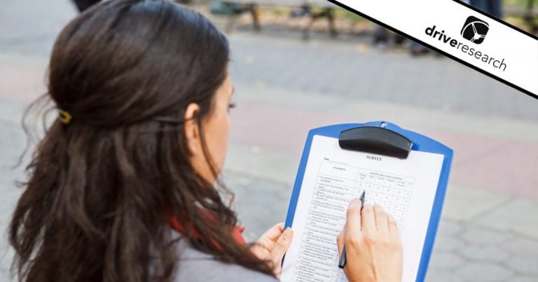 a woman holding a clipboard examining snowball sampling