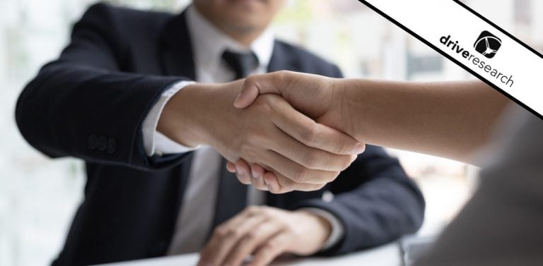 an executive market research interview and people shaking hands