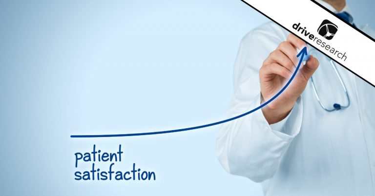 Doctor writing an arrow up that says patient satisfaction