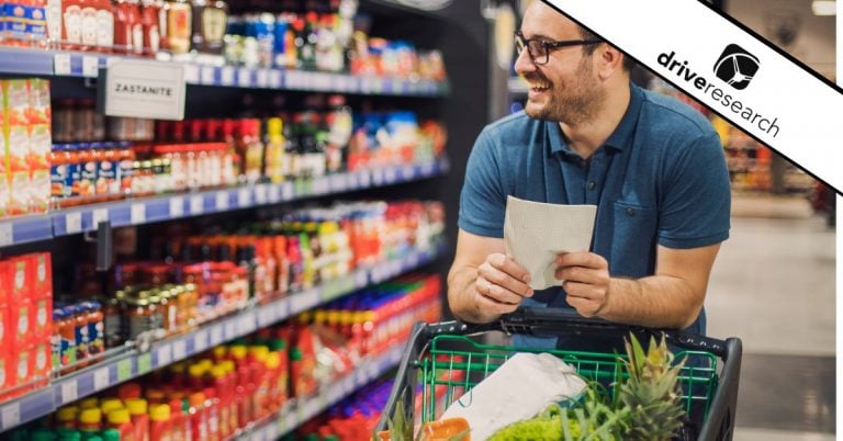 Male with glasses shopping at a grocery store - drive research