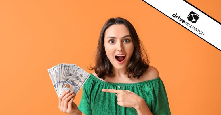 Woman smiling with cash in her hand