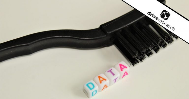 a brush with some dice that spell data showing the data cleaning process