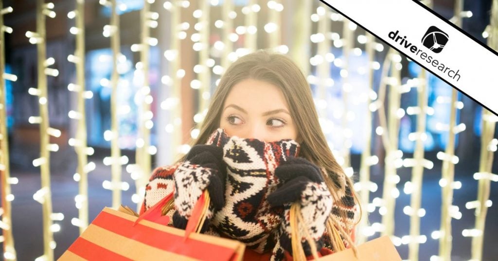 a girl with a mask over her face showing a secret shopper in a store