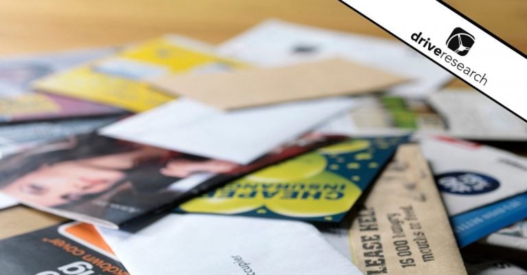 envelopes on the table showing mail surveys