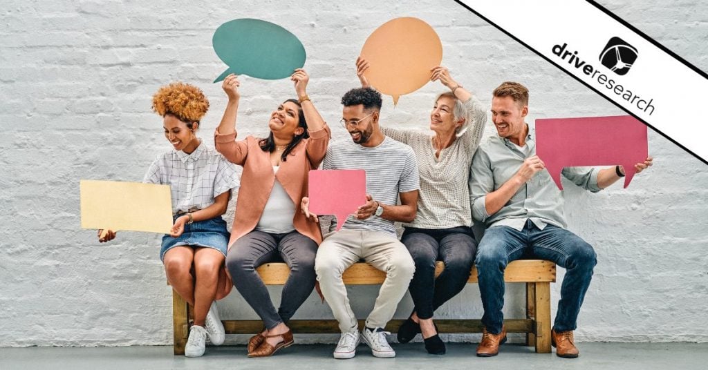 people on a bench holding up quotes showing what voice of customer literally looks like