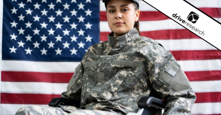 Female veteran in wheel chair in front of american flag