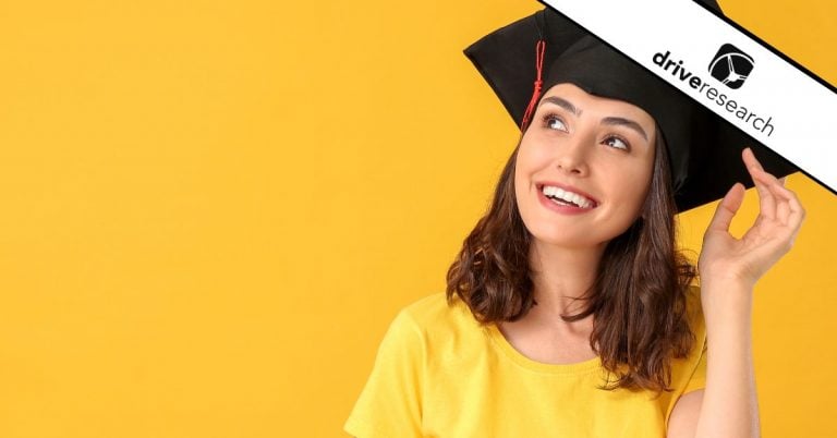 Woman in front of a yellow background wearing a graduation cap