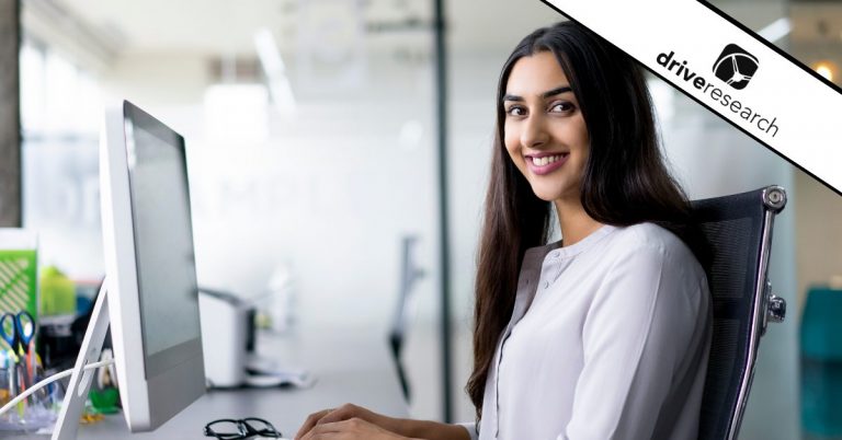 Female employee sitting at her desk portrait