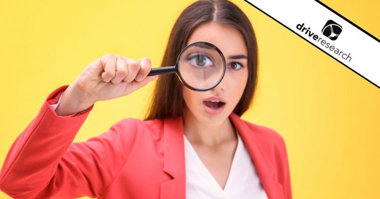 Woman looking through magnifying glass