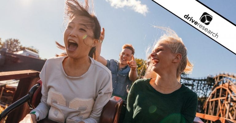 People on a roller coaster at a theme park