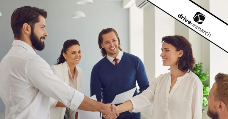 Woman shaking a man's hand - Drive Research