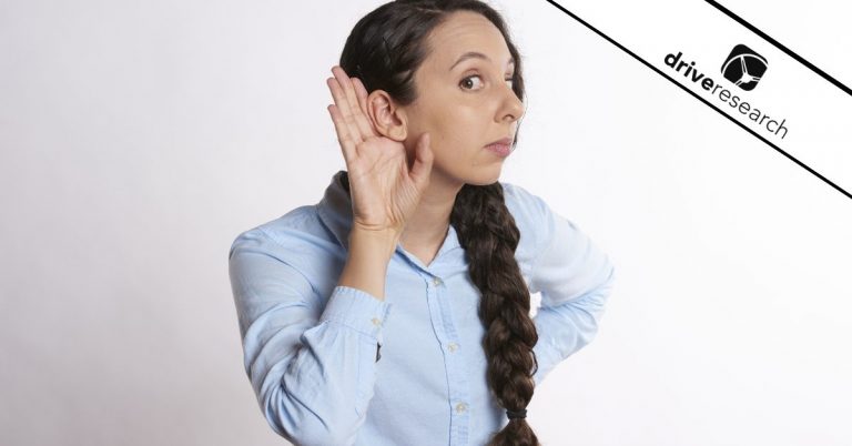 Female listening with hand around ear