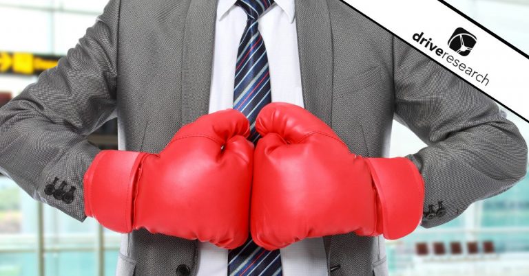 Male in suit wearing boxing gloves