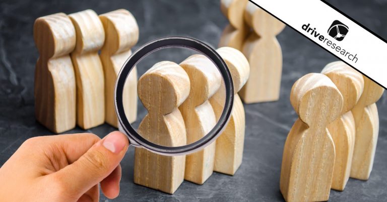 Wooden blocks of customers with a magnifying glass