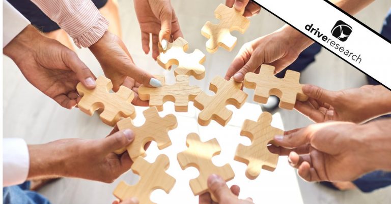 Employee hands putting puzzle pieces together