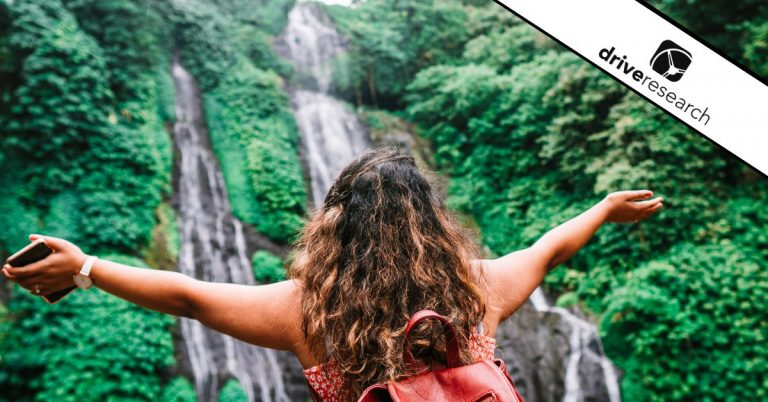 Woman hiking near waterfall