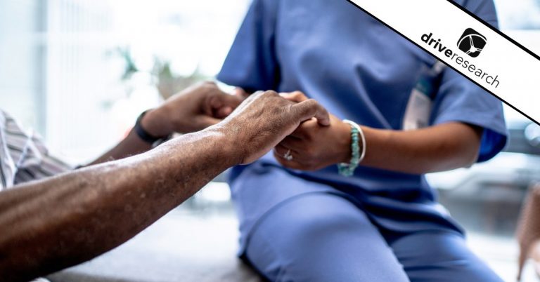 Patient and medical professional holding hands