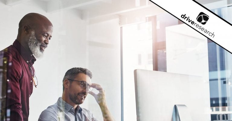 Two males looking at a computer