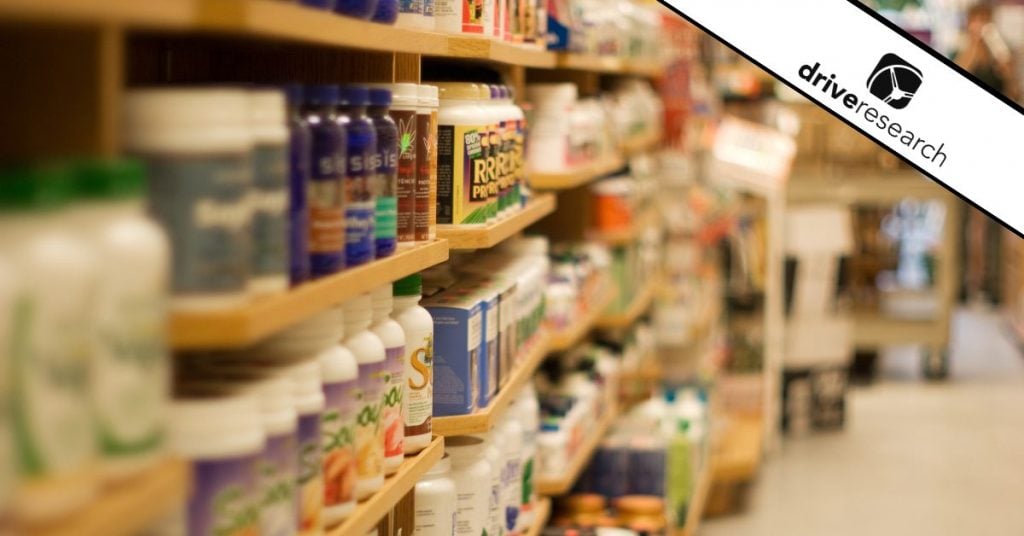 Aisle in grocery store displaying labeled jars