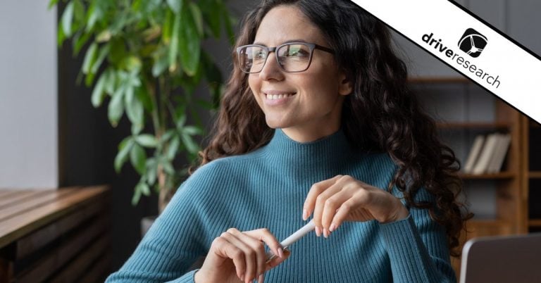 Woman with glasses looking out the window