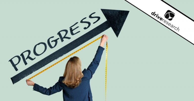 Woman with a tape measuring an arrow that says progress