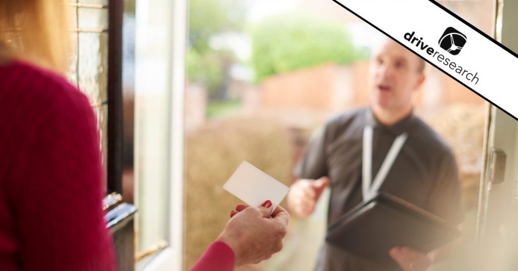 a man and a woman talking in a door to door interview