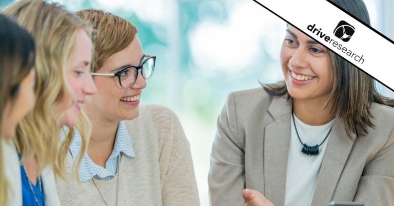 a woman showing other women survey questions for respondent market research