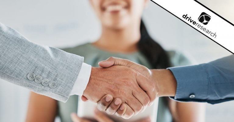 Man shaking hands in front of female