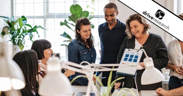 Happy employees talking at work