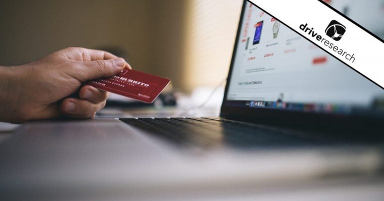 Person using credit card to check out on a computer