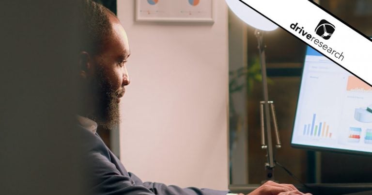 Male looking at stats on computer