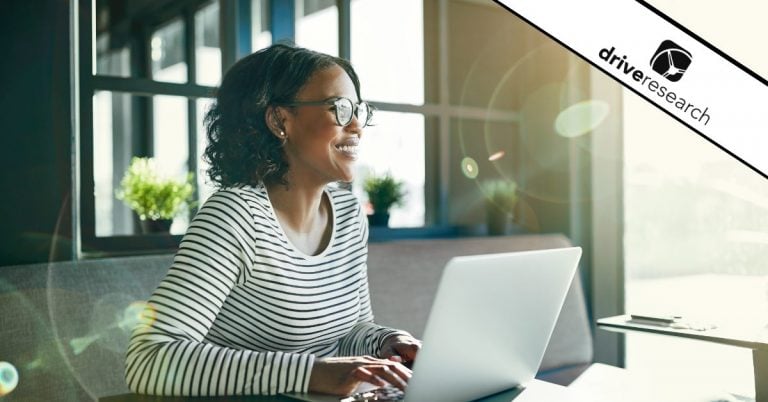 a woman looking out a window in an office